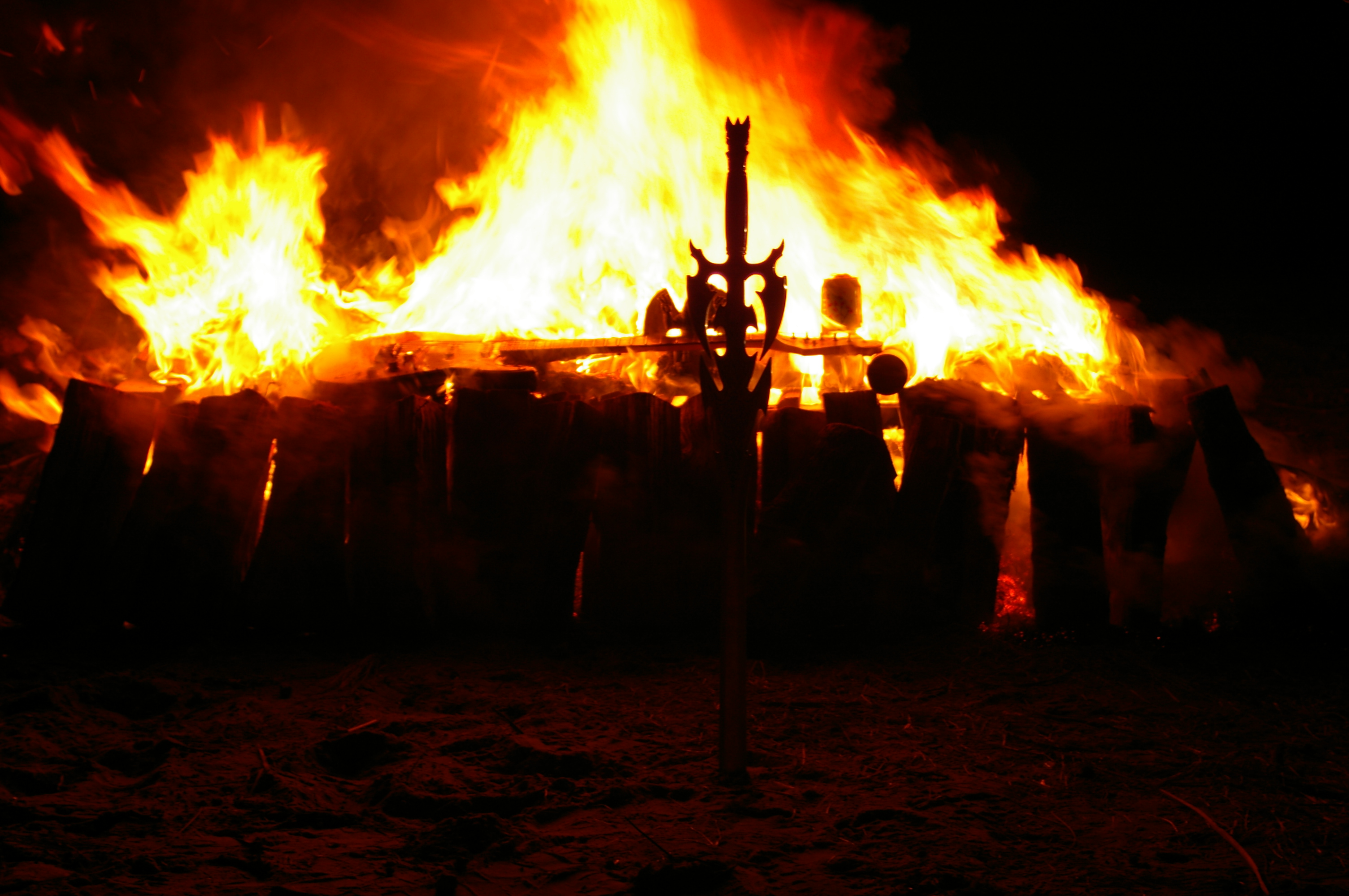 Flaming pyre and Joe's sword